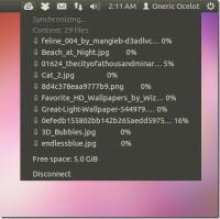 Ubuntu One Göstergesi Sistem Tepsisinden Senkronizasyon İstatistiklerini görüntüler